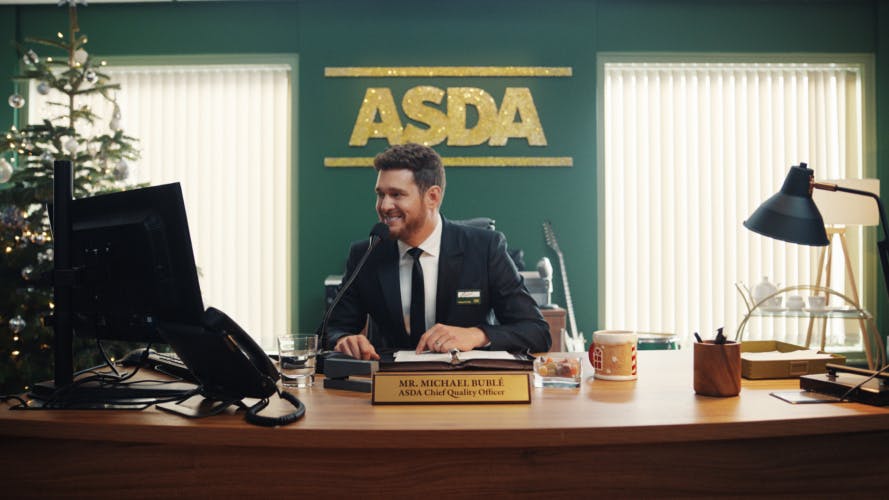 Michael Buble behind the desk at Asda for Christmas